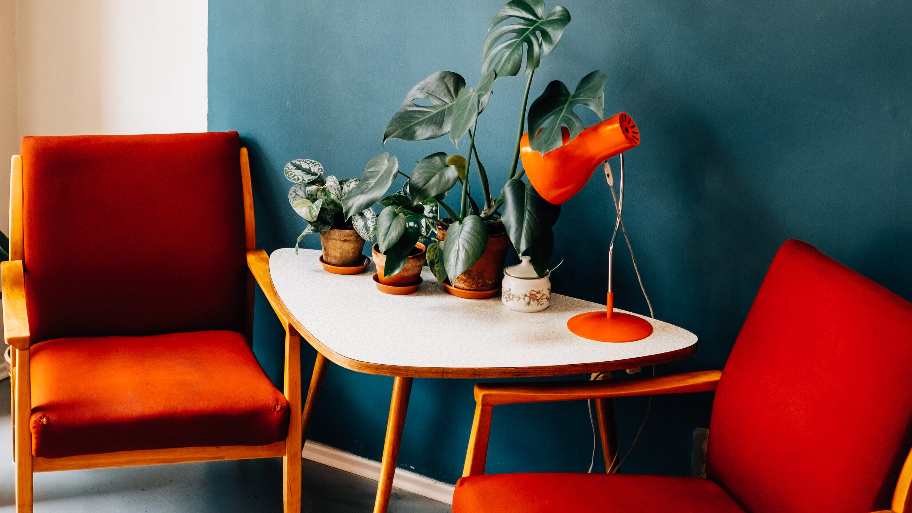two-red-chairs-near-white-table